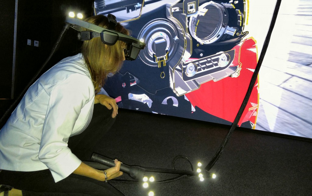 Elizabeth Baron uses Virtual Reality headgear to probe layers of a car that isn't there at the Ford Silicon Valley Research and Innovation Centre in Palo Alto