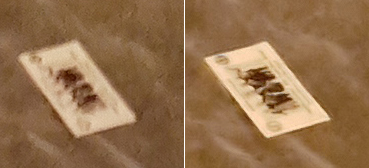 An extreme close-up of the lower left business card in the same photos shows eroded detail and noticeable JPEG artifact on the Note 5, left. Compare the much better defined detail and much less JPEG artifact on the S7 photo, right.